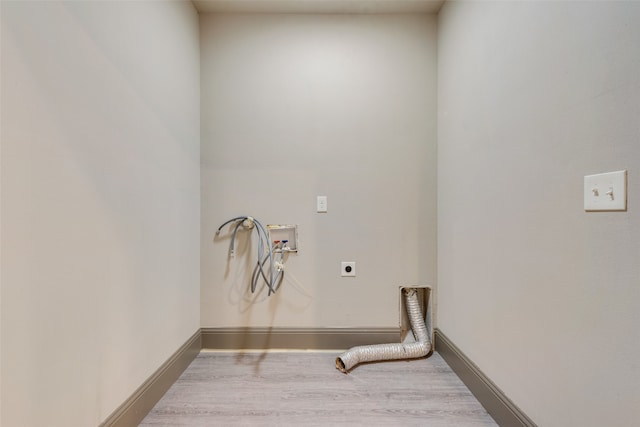 clothes washing area featuring hookup for an electric dryer, wood-type flooring, and hookup for a washing machine