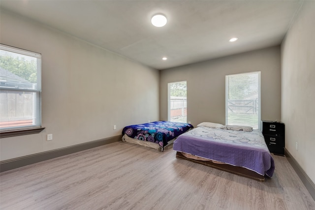 bedroom with light hardwood / wood-style floors