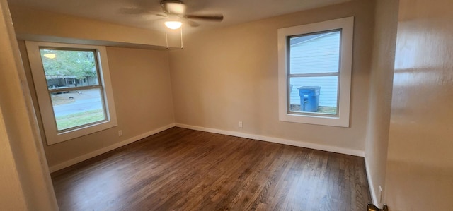 unfurnished room with ceiling fan, dark hardwood / wood-style floors, and plenty of natural light