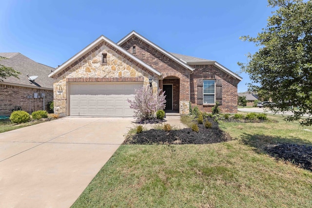 view of front of property featuring a garage, a front yard, concrete driveway, and brick siding