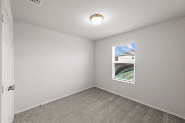 unfurnished room featuring carpet