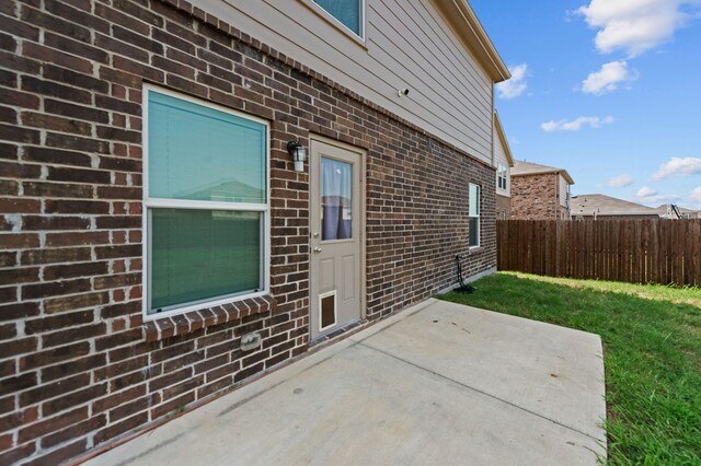 view of home's exterior with a patio