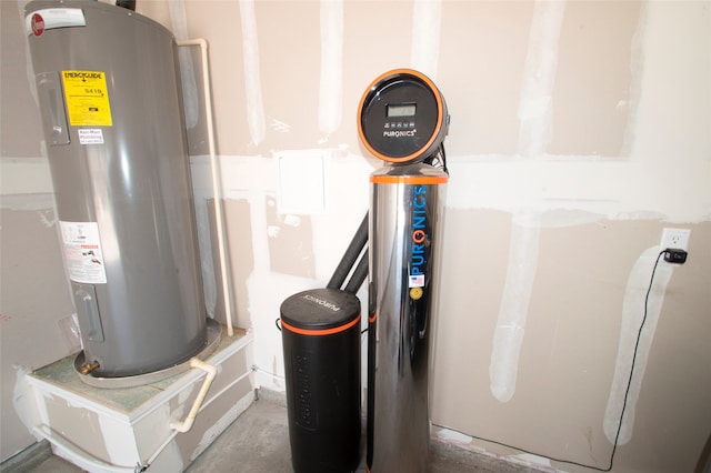 utility room featuring electric water heater