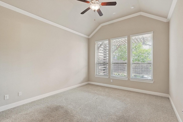 empty room featuring ceiling fan, crown molding, carpet floors, and lofted ceiling