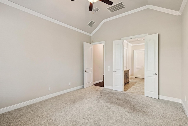 unfurnished bedroom featuring ceiling fan, ornamental molding, light carpet, and lofted ceiling