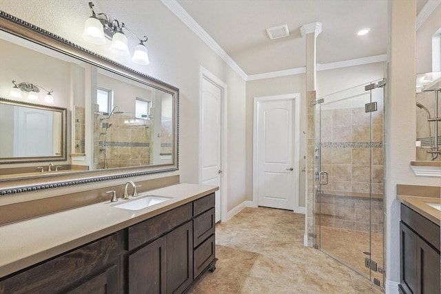 bathroom featuring a shower with shower door, ornamental molding, and vanity