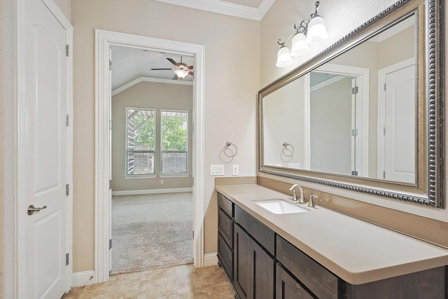 bathroom with vanity, crown molding, ceiling fan with notable chandelier, and vaulted ceiling