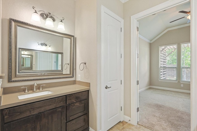 bathroom featuring vanity, crown molding, ceiling fan, and lofted ceiling