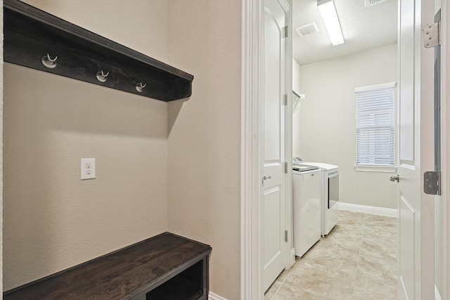 laundry area featuring washing machine and clothes dryer