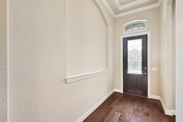 foyer entrance featuring dark hardwood / wood-style floors and crown molding