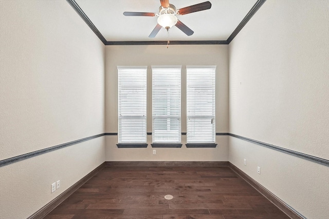 unfurnished room with ceiling fan, dark hardwood / wood-style flooring, and crown molding