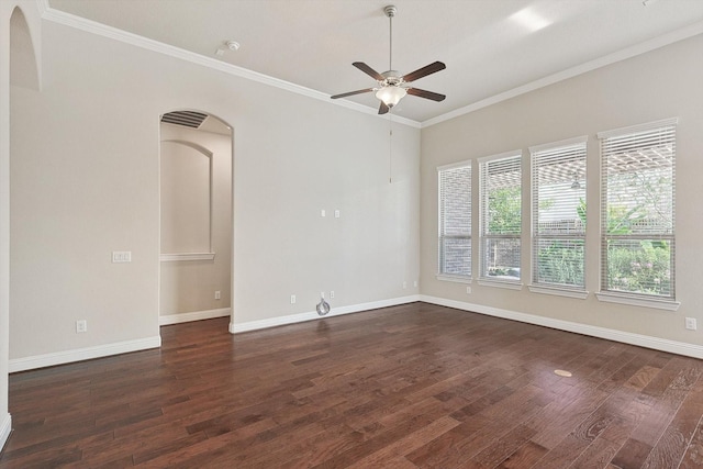 spare room featuring dark hardwood / wood-style floors, a wealth of natural light, and ceiling fan