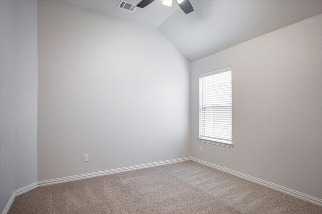 unfurnished room featuring carpet floors, ceiling fan, and vaulted ceiling