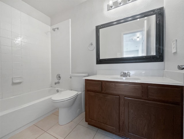 full bathroom featuring vanity, tiled shower / bath, tile patterned floors, and toilet