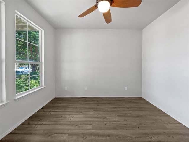 spare room featuring wood-type flooring and ceiling fan