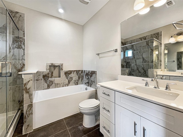 full bathroom featuring vanity, toilet, and independent shower and bath