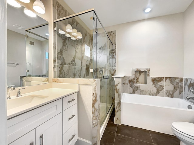 full bathroom featuring vanity, toilet, separate shower and tub, and tile patterned flooring