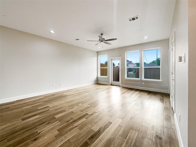 spare room featuring ceiling fan and light hardwood / wood-style floors