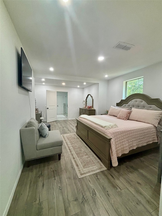 bedroom featuring hardwood / wood-style flooring