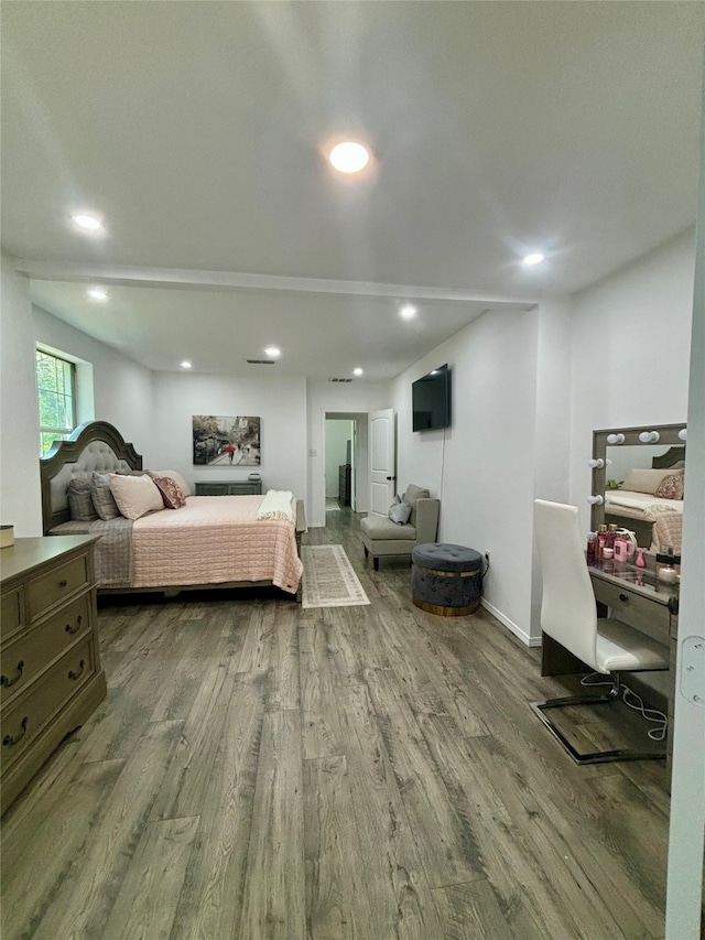 bedroom with hardwood / wood-style flooring