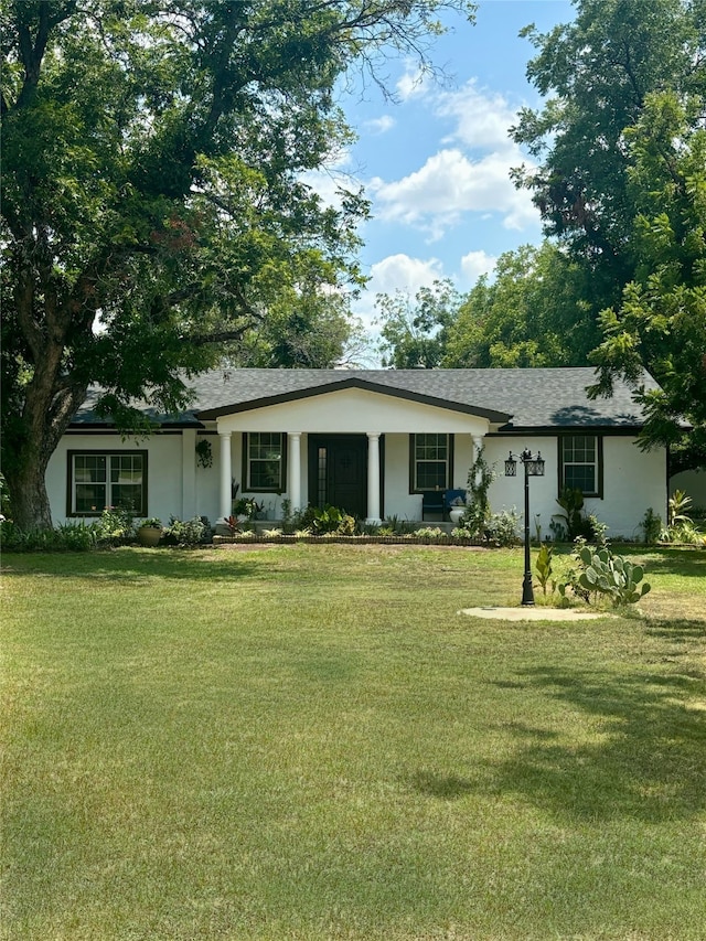 ranch-style home with a front lawn