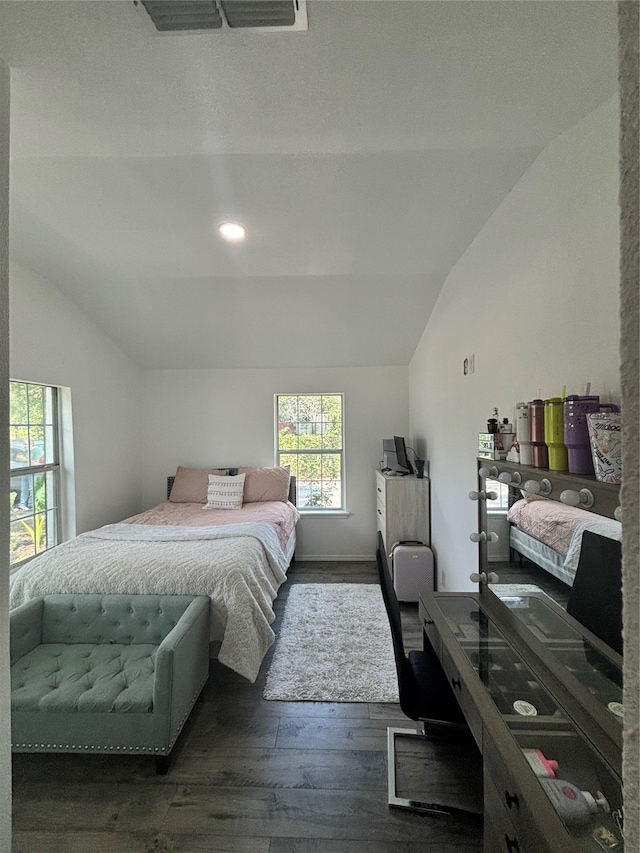 bedroom with dark wood-type flooring and vaulted ceiling