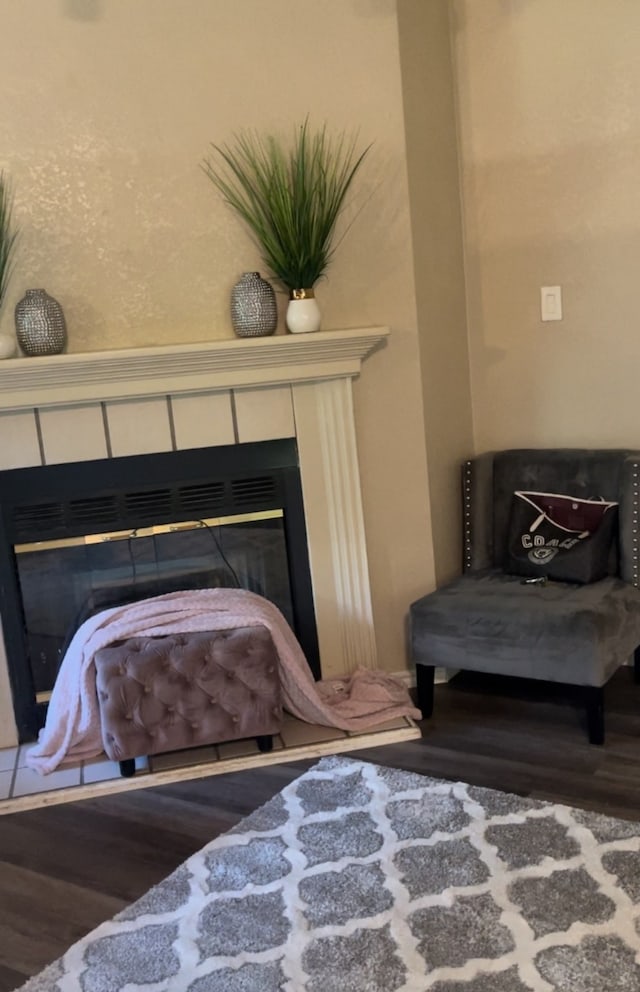 sitting room featuring hardwood / wood-style flooring and a fireplace