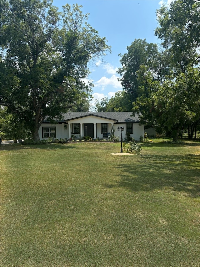 view of front of home with a front yard