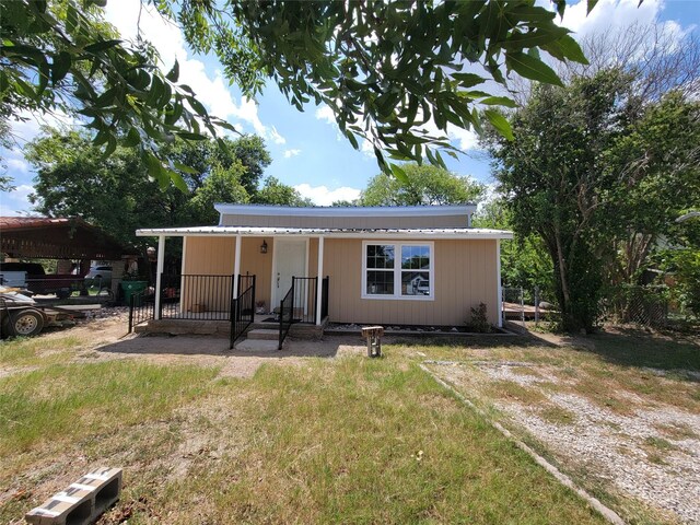 rear view of property with a porch