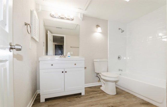 full bathroom featuring hardwood / wood-style flooring, vanity, toilet, and bathtub / shower combination