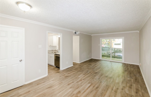 interior space featuring sink, ornamental molding, a textured ceiling, and light wood-type flooring