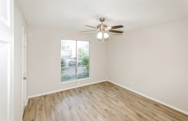 spare room featuring light hardwood / wood-style floors and ceiling fan