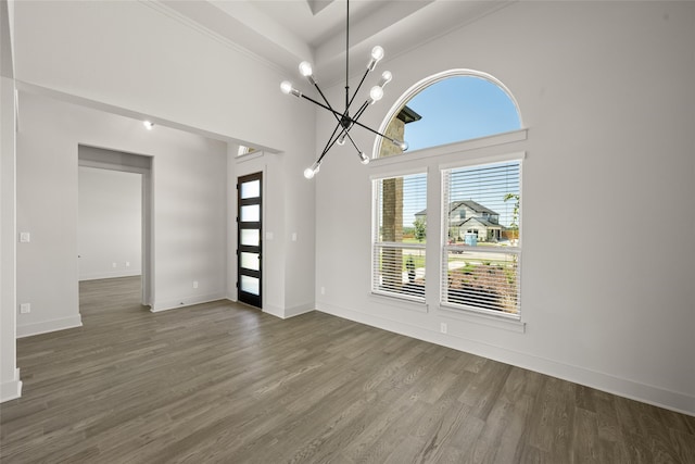 interior space with a chandelier and dark hardwood / wood-style floors