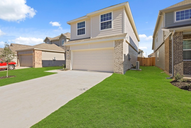 view of front property with central air condition unit, a front lawn, and a garage