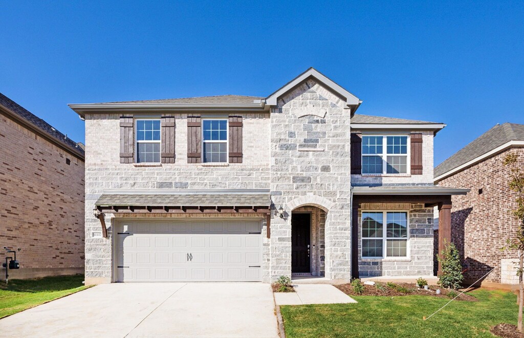 11117 Boyne Ave, Fort Worth, TX 76052 - view of front of home featuring a front lawn and a garage