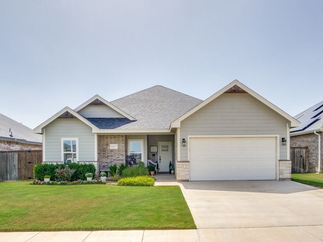 view of front of home featuring driveway, a shingled roof, an attached garage, fence, and a front lawn