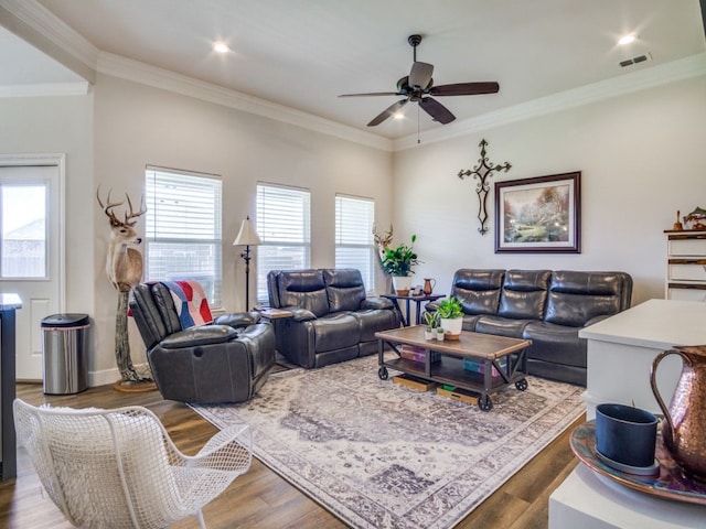 living room featuring ornamental molding, hardwood / wood-style flooring, and ceiling fan