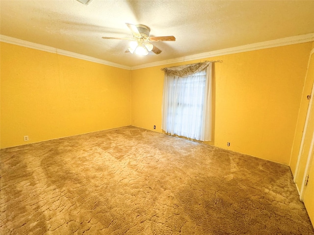 carpeted empty room featuring crown molding, a textured ceiling, and ceiling fan