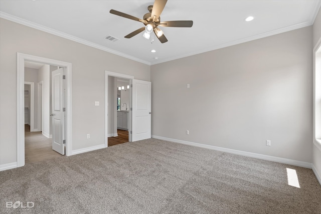 unfurnished bedroom featuring ornamental molding, sink, ceiling fan, and carpet floors