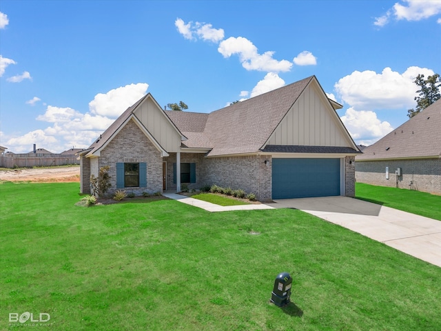 view of front of property featuring a front lawn and a garage