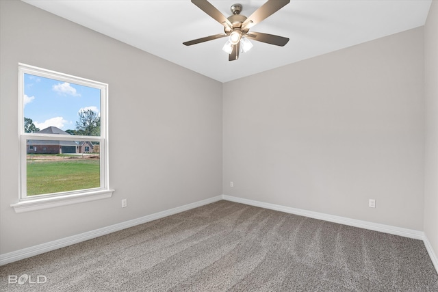 unfurnished room featuring ceiling fan and carpet flooring