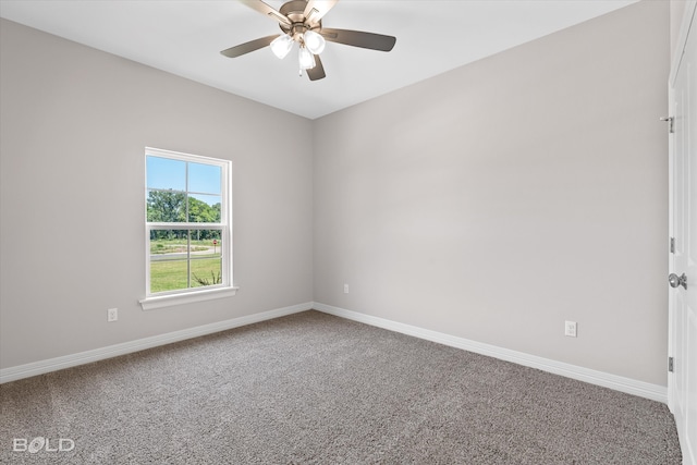 carpeted spare room with ceiling fan