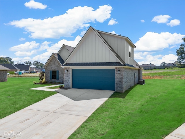 view of front of property featuring a front lawn and a garage