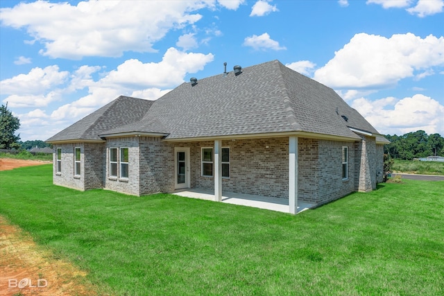 back of house featuring a patio and a yard