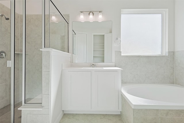 full bathroom with vanity, tile patterned flooring, a shower stall, and a bath