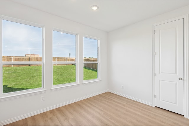 spare room featuring light hardwood / wood-style floors