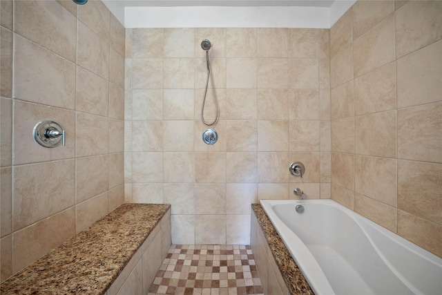 full bathroom featuring tiled shower and a bath