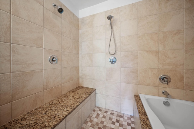 bathroom with a tile shower and a bathtub