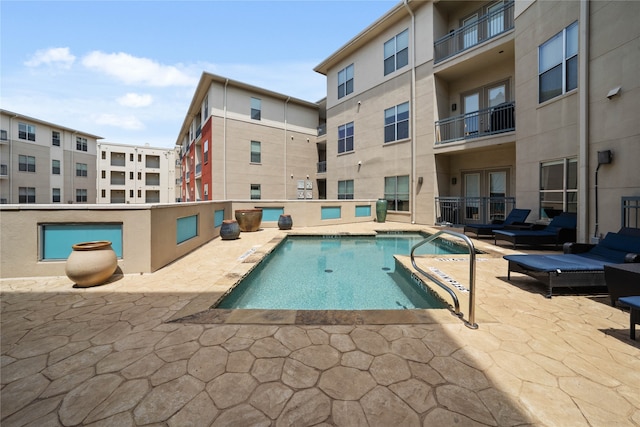 view of pool with a patio area