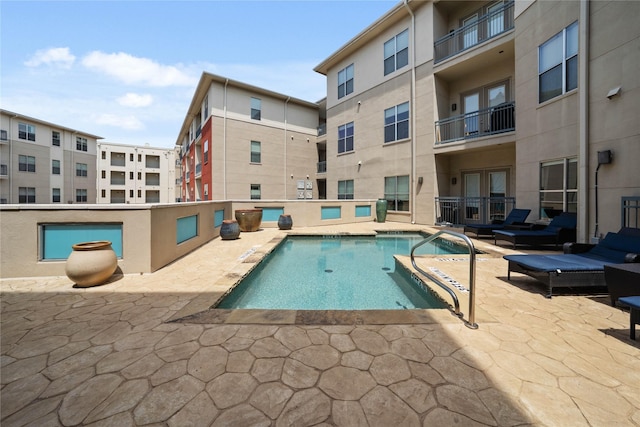 pool featuring a patio area